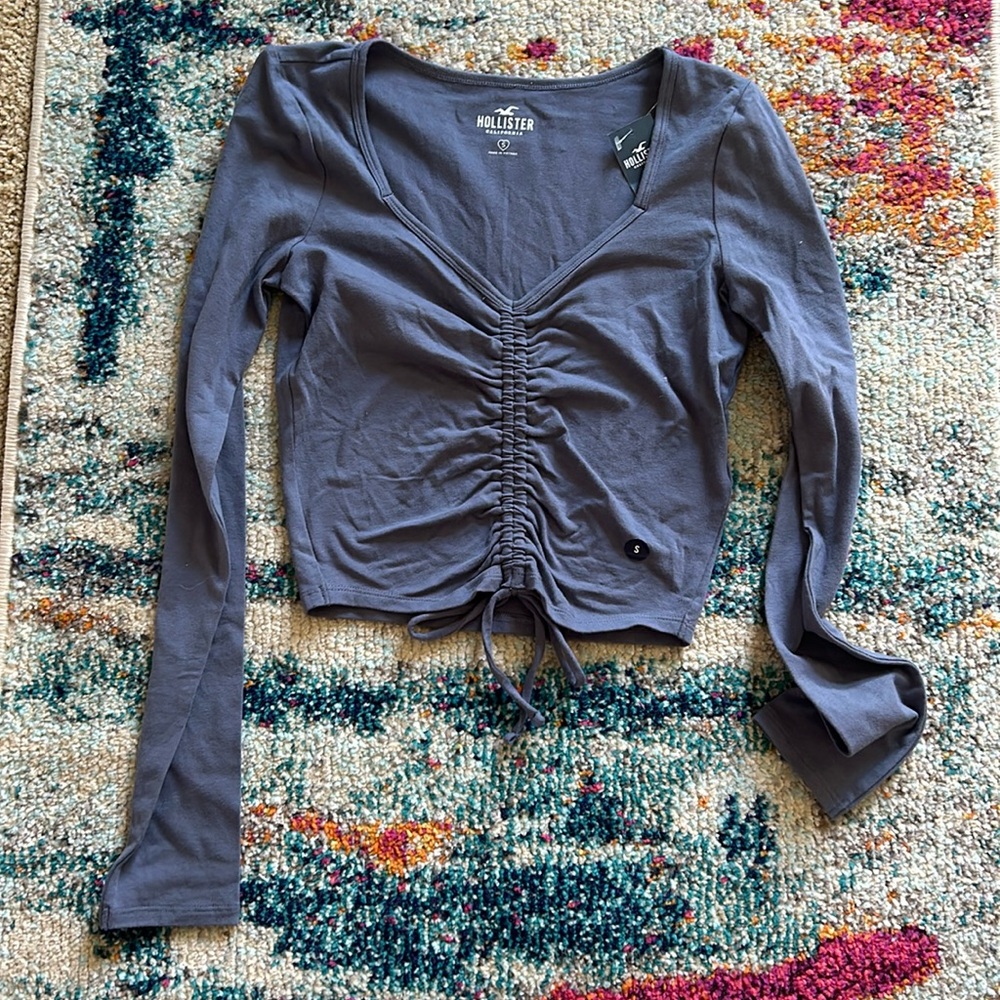 Never worn with tags. Gray/blue long sleeve Hollister shirt size S